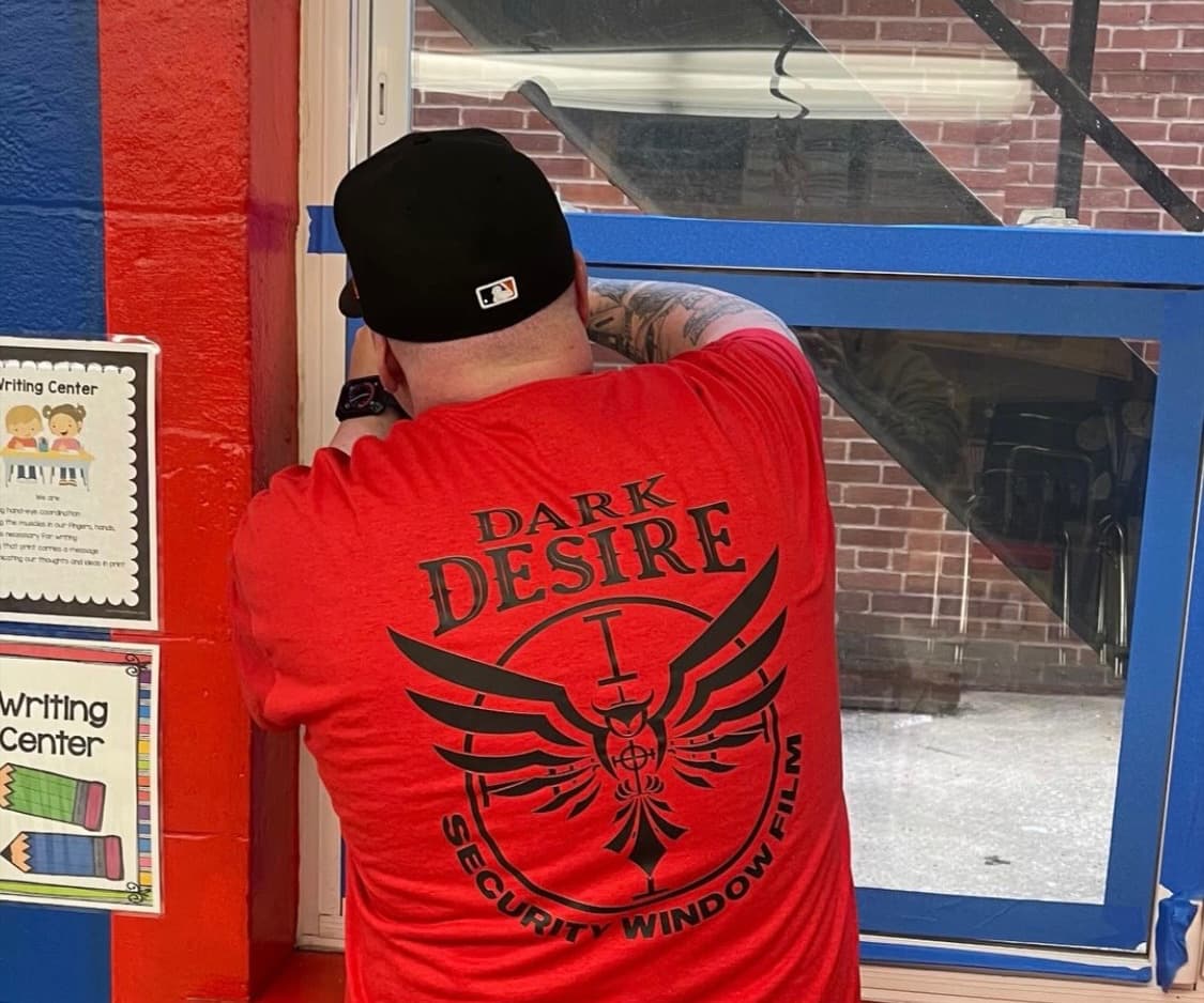 Carl Brunner Installing Security Film on a Window in Westminster, MD